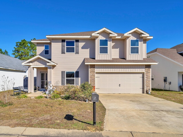 view of front of home featuring a garage and a front lawn