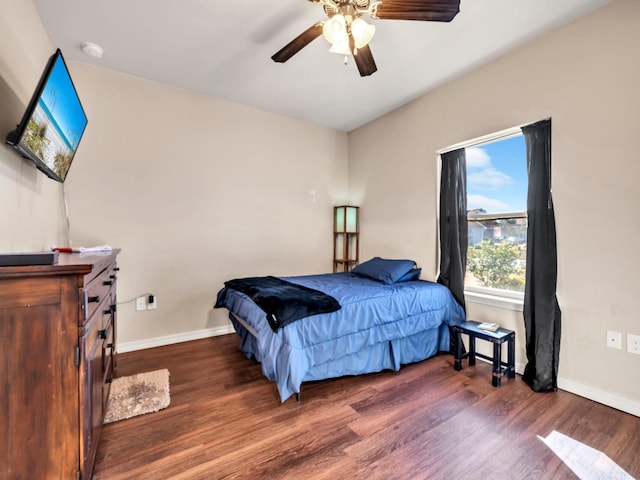 bedroom featuring ceiling fan and dark hardwood / wood-style floors