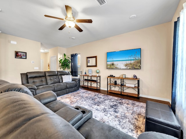 living room with hardwood / wood-style floors and ceiling fan