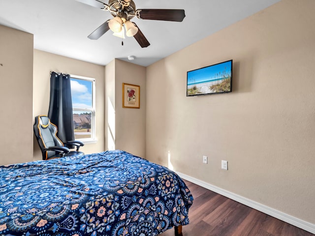 bedroom featuring ceiling fan and dark hardwood / wood-style flooring