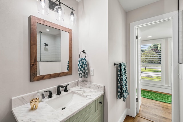 bathroom with wood-type flooring and vanity