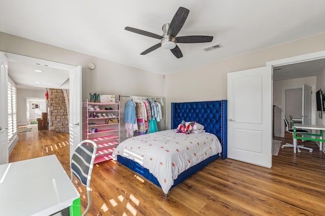 bedroom featuring ceiling fan and wood-type flooring