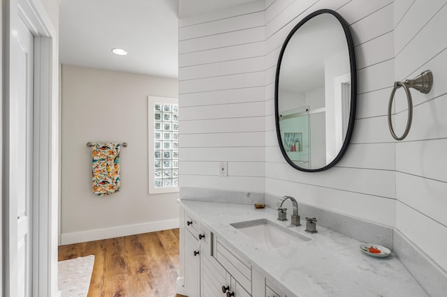 bathroom with wood-type flooring and vanity