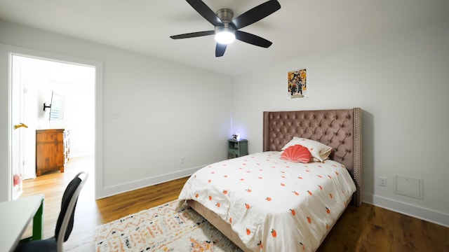 bedroom featuring ceiling fan and hardwood / wood-style flooring