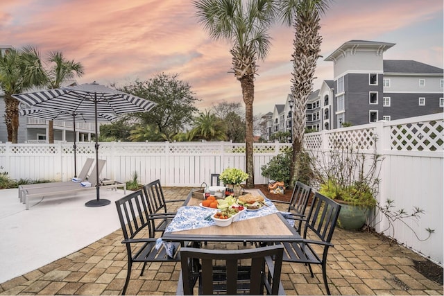 view of patio terrace at dusk