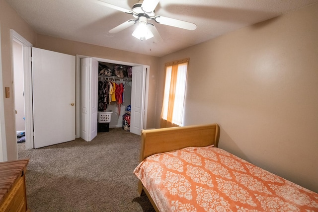 carpeted bedroom with ceiling fan and a closet