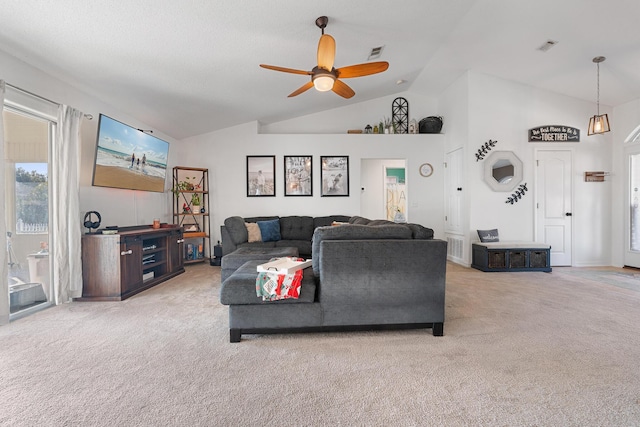 living room with light carpet, ceiling fan, and vaulted ceiling