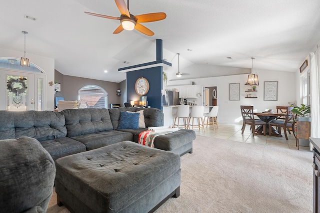 living room featuring light carpet, ceiling fan, and lofted ceiling