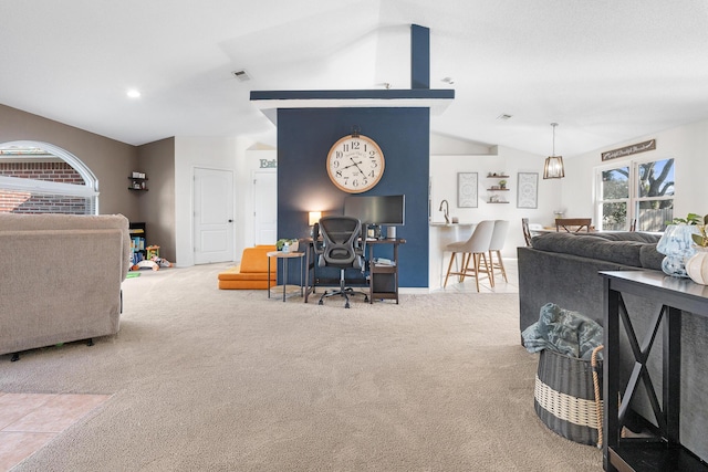 living room featuring light colored carpet and vaulted ceiling