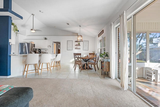 interior space with vaulted ceiling and ceiling fan