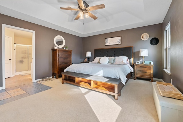 bedroom with connected bathroom, ceiling fan, and light colored carpet