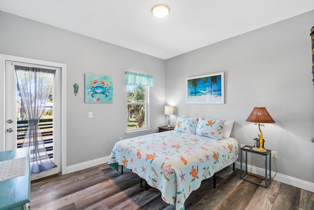 bedroom with dark wood-type flooring and access to outside