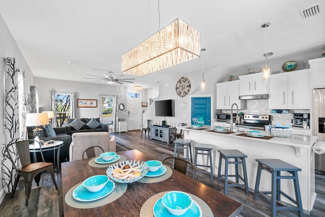 dining room featuring ceiling fan and dark hardwood / wood-style floors