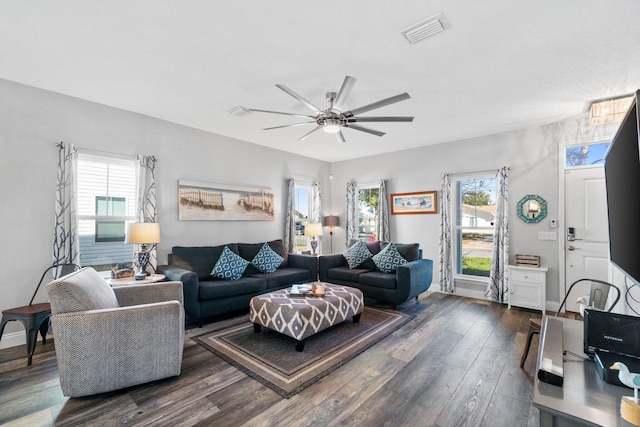 living room featuring plenty of natural light, dark hardwood / wood-style floors, and ceiling fan