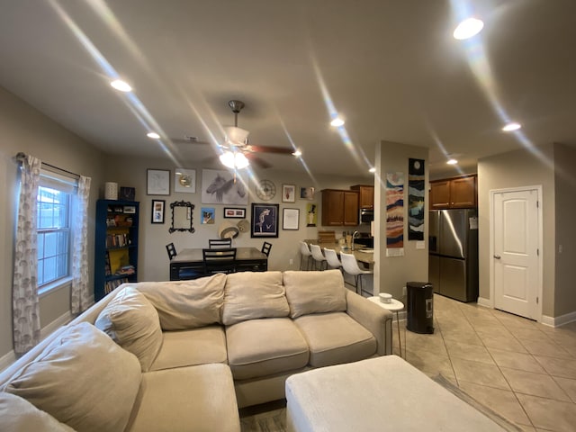 tiled living room with ceiling fan