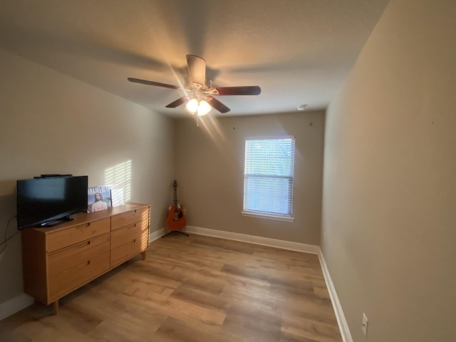 bedroom with light hardwood / wood-style floors, multiple windows, and ceiling fan