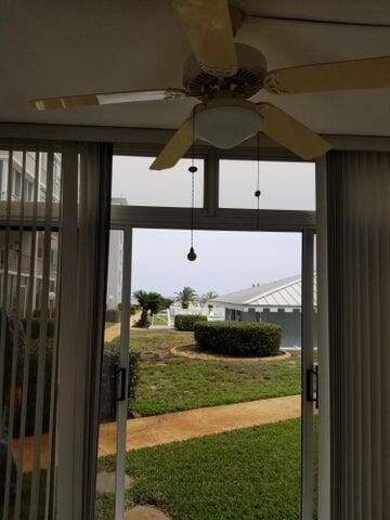 doorway featuring plenty of natural light and ceiling fan