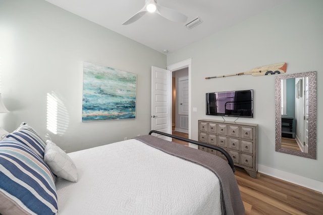 bedroom with hardwood / wood-style flooring and ceiling fan