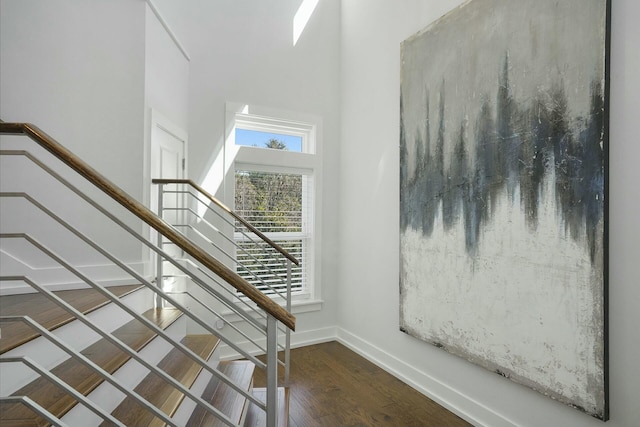 stairs featuring wood-type flooring