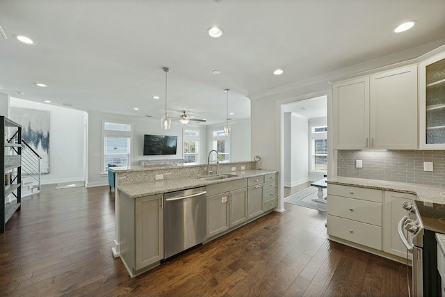 kitchen featuring ceiling fan, sink, dark hardwood / wood-style floors, decorative light fixtures, and appliances with stainless steel finishes