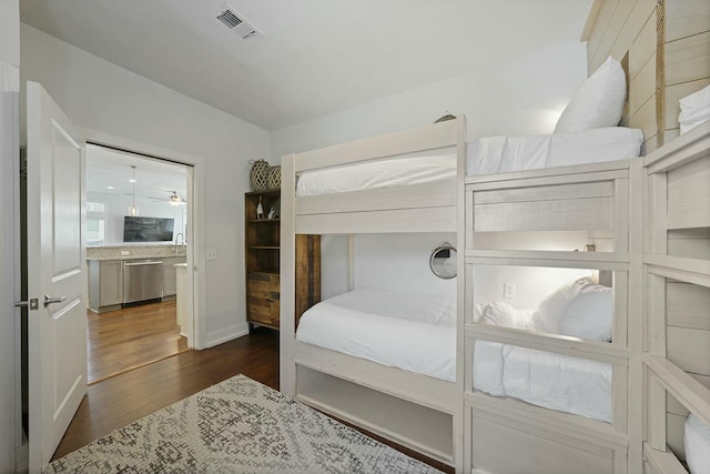 bedroom featuring dark hardwood / wood-style floors and sink