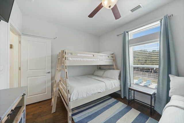 bedroom featuring ceiling fan and dark hardwood / wood-style floors