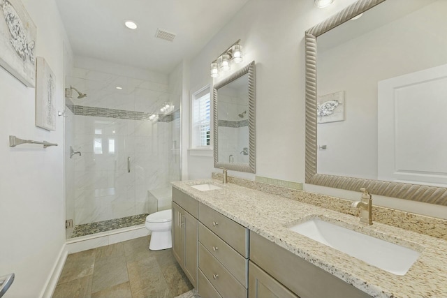 bathroom featuring toilet, an enclosed shower, and vanity