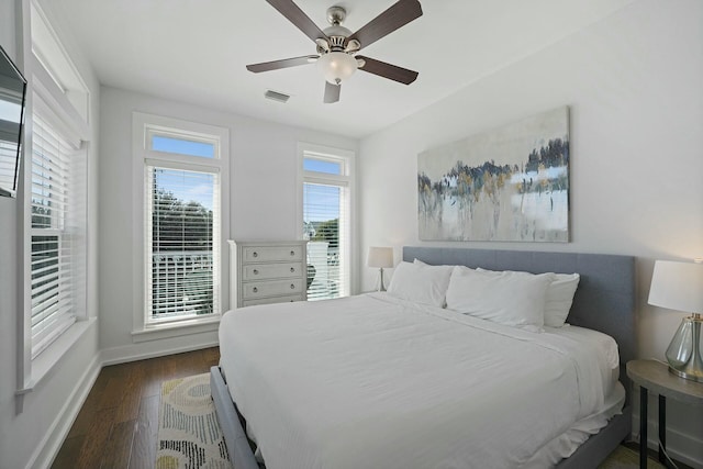 bedroom featuring ceiling fan and dark hardwood / wood-style flooring