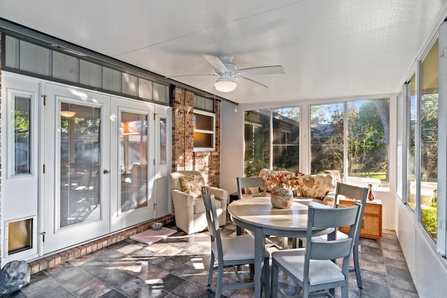 sunroom featuring ceiling fan and a healthy amount of sunlight