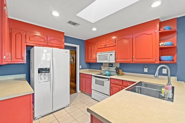 kitchen featuring white appliances, a skylight, crown molding, and sink