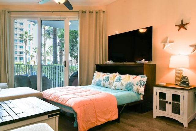 bedroom with access to exterior, ceiling fan, and dark wood-type flooring