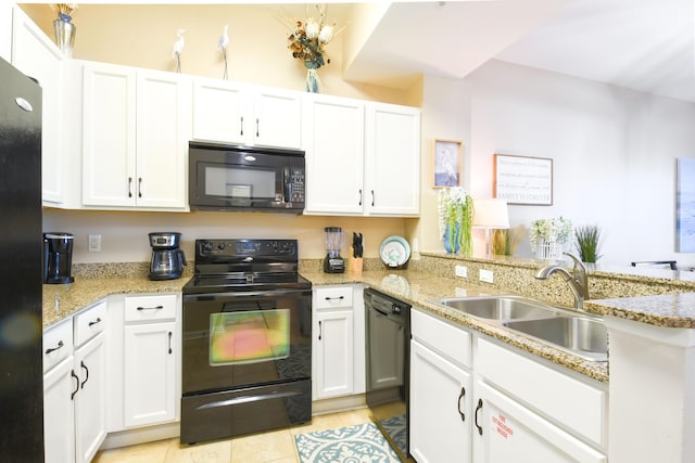 kitchen with white cabinetry and black appliances