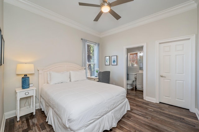 bedroom featuring crown molding, ceiling fan, dark hardwood / wood-style flooring, and ensuite bathroom