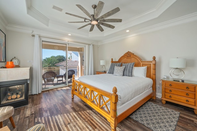 bedroom featuring access to exterior, ceiling fan, a raised ceiling, and crown molding