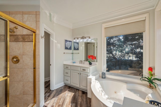 bathroom featuring ornamental molding, vanity, independent shower and bath, and wood-type flooring