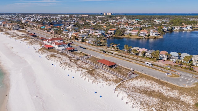 drone / aerial view with a view of the beach and a water view