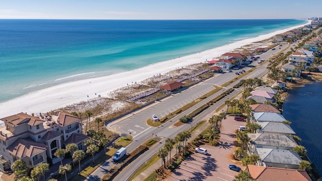 aerial view with a view of the beach and a water view