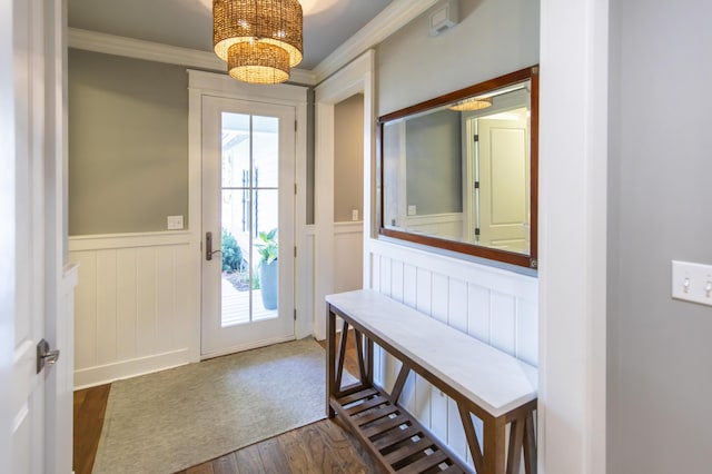 entryway with dark wood-type flooring and ornamental molding