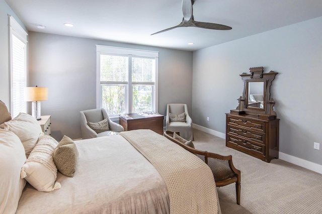 bedroom featuring ceiling fan and light colored carpet