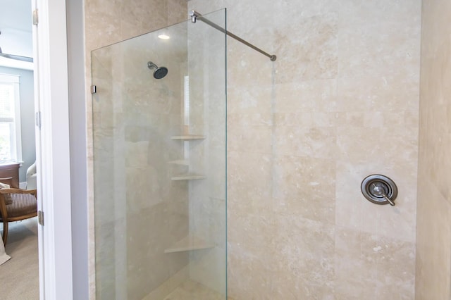 bathroom featuring a tile shower