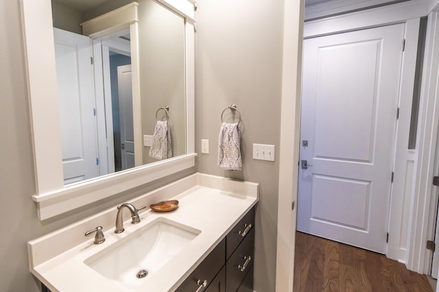 bathroom featuring wood-type flooring and vanity