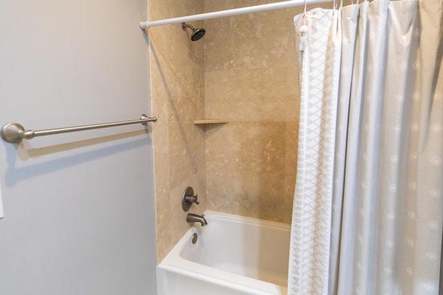 bathroom with shower / bath combination with curtain