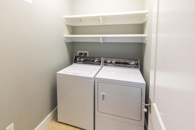 laundry room with independent washer and dryer