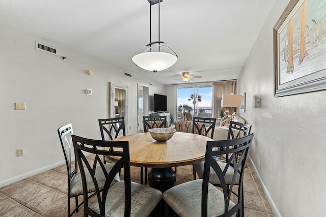 dining room featuring ceiling fan