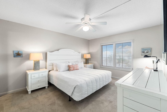 bedroom with dark colored carpet, a textured ceiling, and ceiling fan