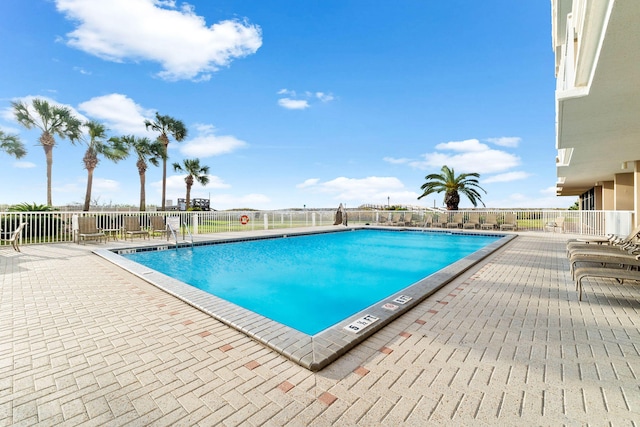 view of swimming pool with a patio area