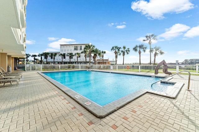 view of swimming pool featuring a patio