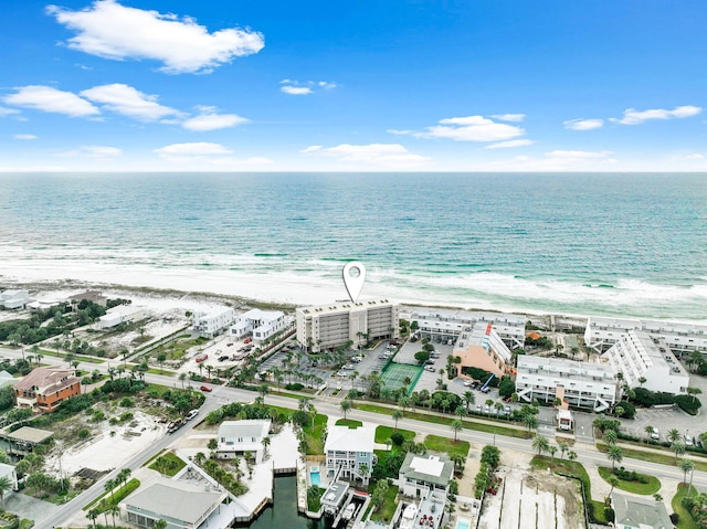 birds eye view of property with a beach view and a water view