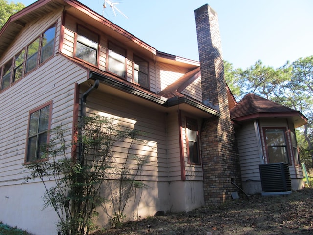 view of property exterior with central air condition unit