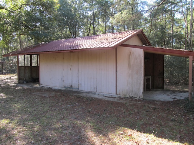 view of side of property with an outbuilding